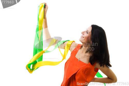Image of Woman in orange dress with flying ribbon