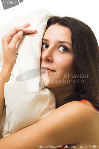 Image of One beautiful woman with pillow waking up