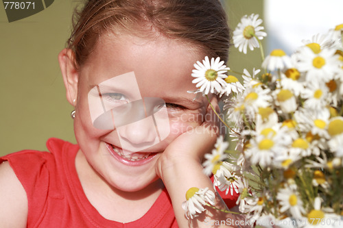 Image of Little girl with chamomile