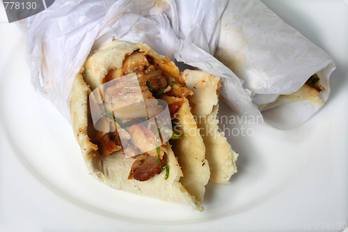 Image of Chicken shawarma sandwich wraps on a plate