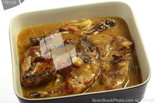 Image of Chicken legs cooking in lemon and garlic sauce