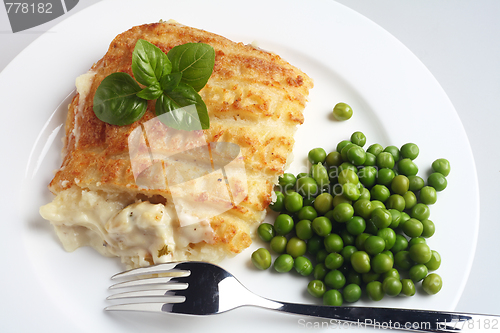 Image of Fish and potato pie with peas and fork