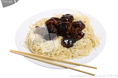 Image of Sweet and sour meatballs and chopsticks