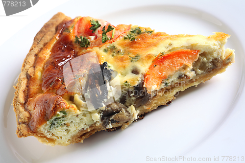 Image of Quiche slice on a white plate