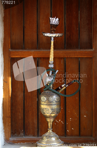 Image of Hookah pipe and window