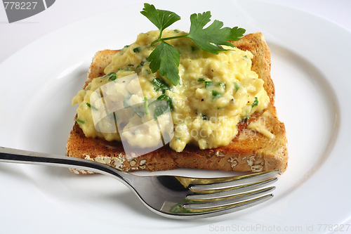 Image of Scrambled egg with parsley on toast