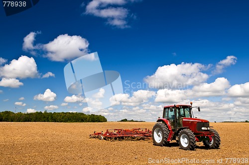 Image of Tractor in plowed field