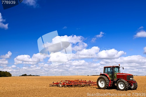 Image of Tractor in plowed field