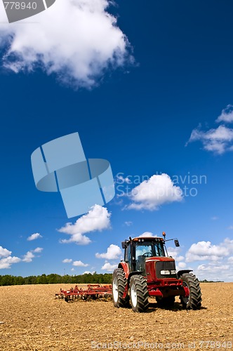 Image of Tractor in plowed field