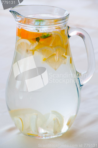 Image of Pitcher with water and fruits