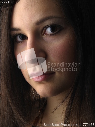 Image of Young brunette on black