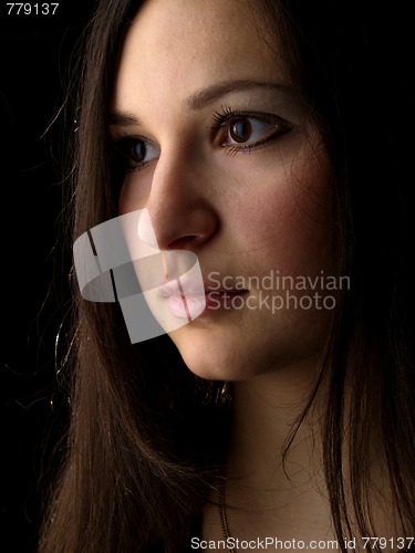 Image of Young brunette on black