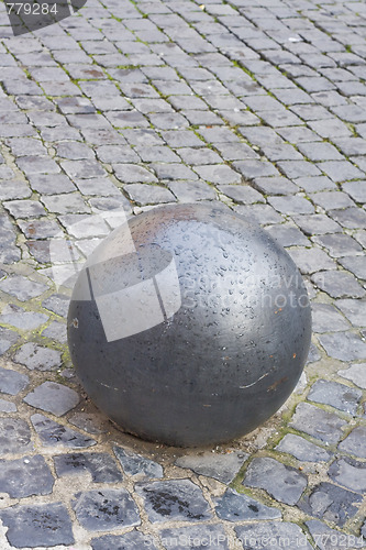 Image of iron ball on cobblestone