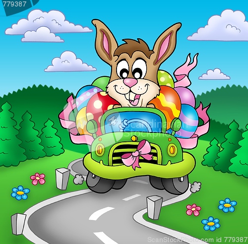 Image of Easter bunny driving car on road