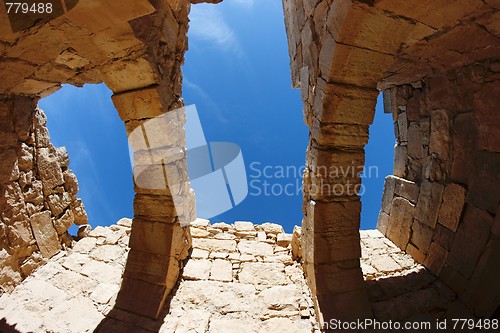 Image of Blue sky seen through the holes in the roof of ruined ancient building