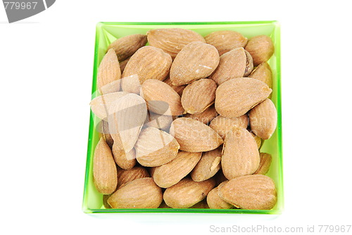 Image of Bunch of almond nuts on a green cup