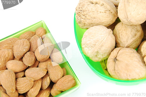 Image of Almond and walnuts on a green cup's
