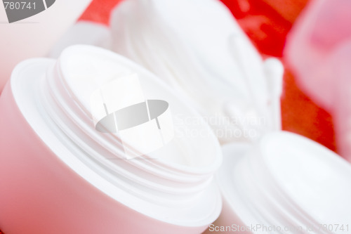 Image of facial cream and cotton pads