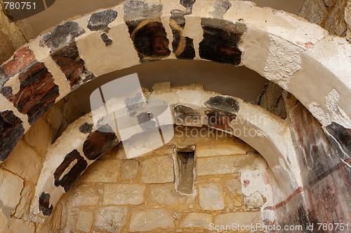 Image of Ancient stone arches with fresco remains