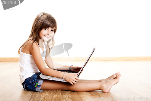 Image of Child playing with a laptop