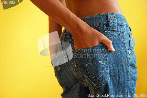 Image of Young skinny girl in jeans