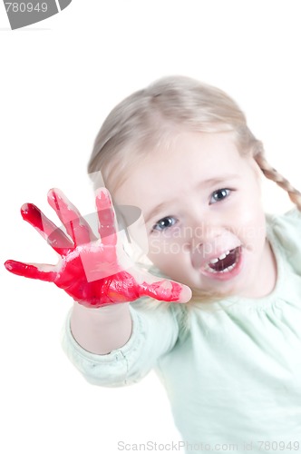 Image of Little girl playing with colors