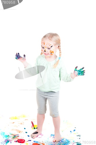 Image of Little girl playing with colors