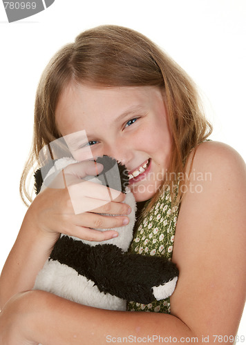Image of girl hugging her teddy bear