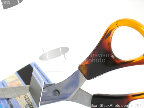Image of Scissors cutting through unwanted credit card.