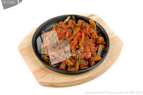 Image of meat with vegetables at pan