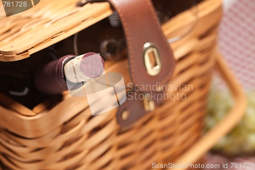 Image of Picnic Basket, Wine Bottle and Empty Glasses