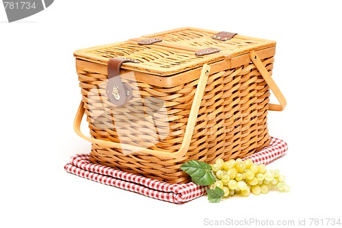 Image of Picnic Basket, Grapes and Folded Blanket Isolated