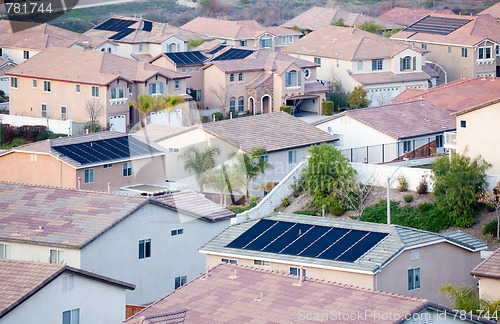 Image of Contemporary Neighborhood Roof Tops with Solar Panels