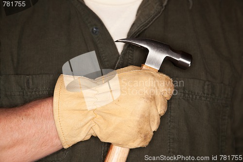 Image of Man with Leather Construction Glove Holding Hammer