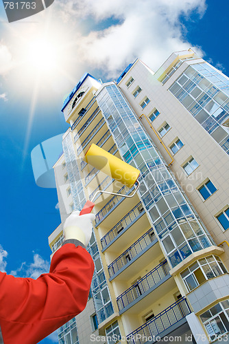 Image of Skyscraper and house painter
