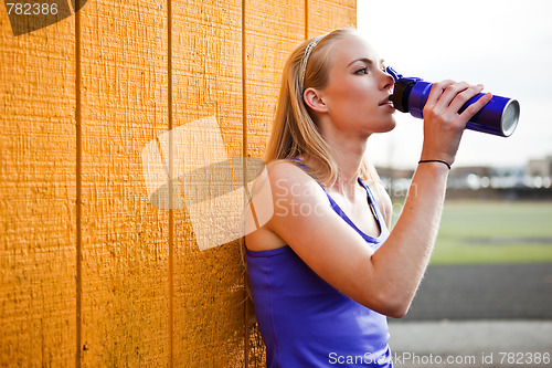 Image of Sporty woman drinking