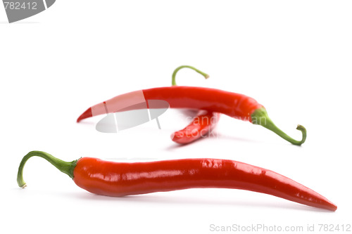 Image of three red chili peppers