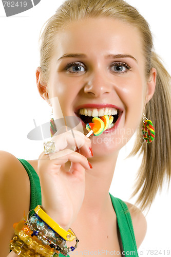 Image of blond woman licking candy