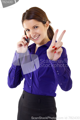 Image of  woman with victory gesture and mobile phone