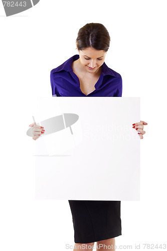 Image of Young woman holding blank sign 