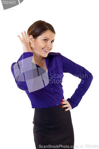 Image of Young business woman cupping hand behind ear