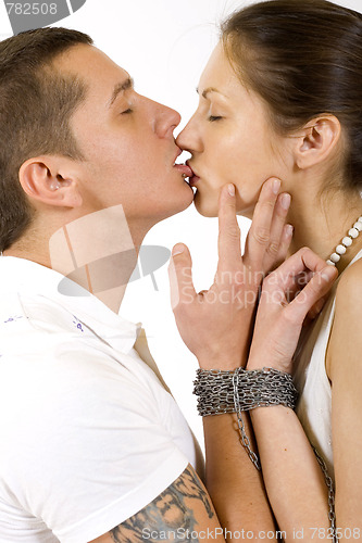 Image of young couple  slave to love