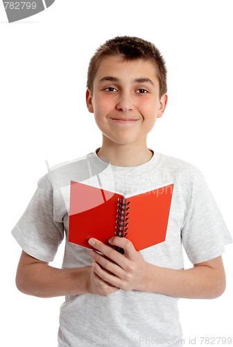 Image of Student holding book in both hands