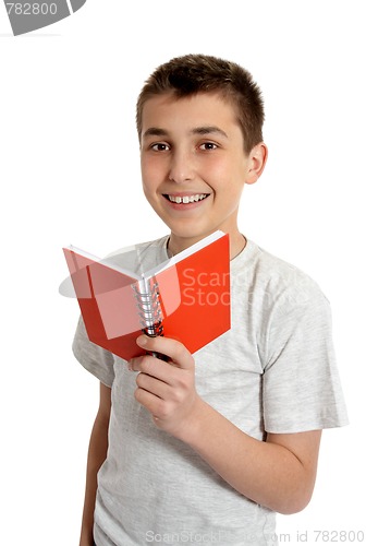 Image of Smiling school student holding small book