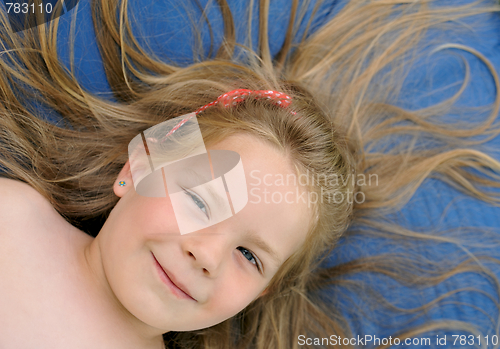 Image of Little girl sunbathing