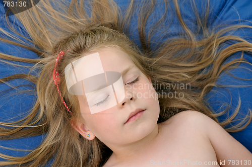 Image of Little girl sunbathing