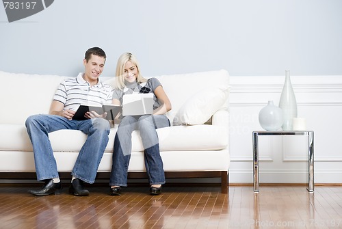 Image of Happy Couple Relaxing on Couch