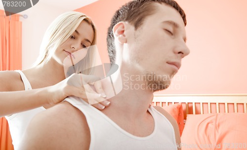 Image of Woman Massaging Man's Shoulders