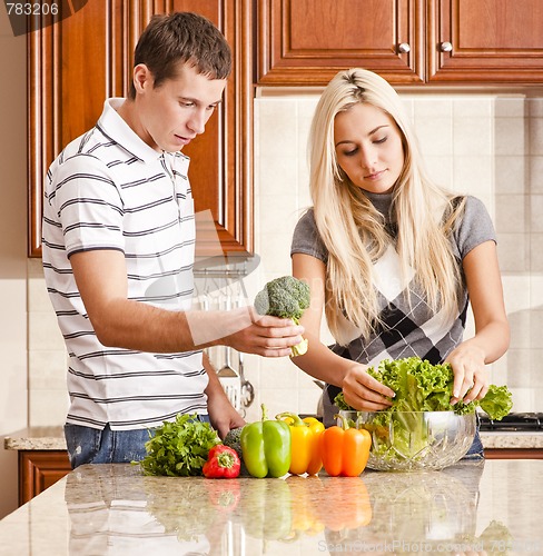 Image of Young Couple Making Salad