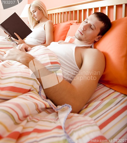 Image of Couple Relaxing in Bed